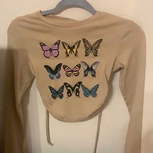 Urban Nation size M butterfly top